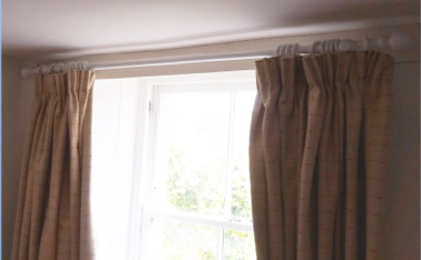 Curtains hung on a curtain pole