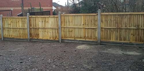 Fencing run built uisng concrete posts and concrete gravel boards