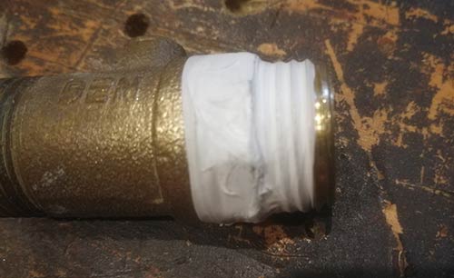 PTFE tape wound around thread on joint