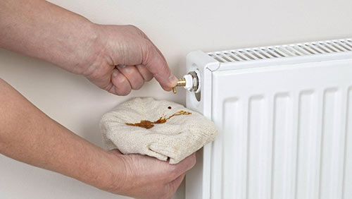 Bleeding a radiator to remove air locks