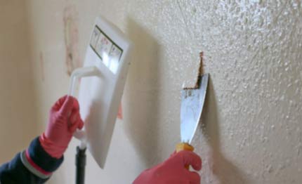 Removing wallpaper with a steamer