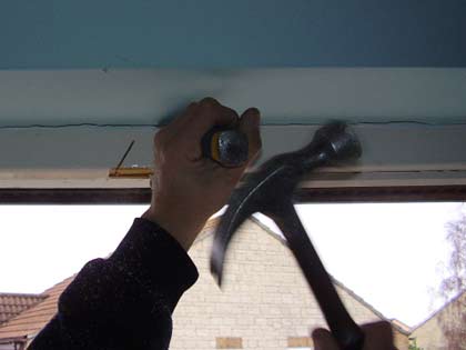 Remove the window head timber by firstly making an angled cut