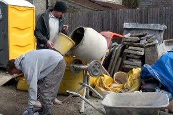 Mixing sand and cement render in a mixer