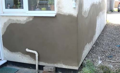 Smoothed render finish ready for Tyrolean coating