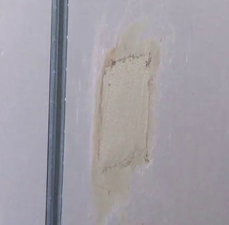 Filled hole in plasterboard