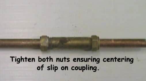 Tighten both nuts at either end of the coupling