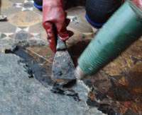 Gentley heat and scrape the lino and bitumen from the floor