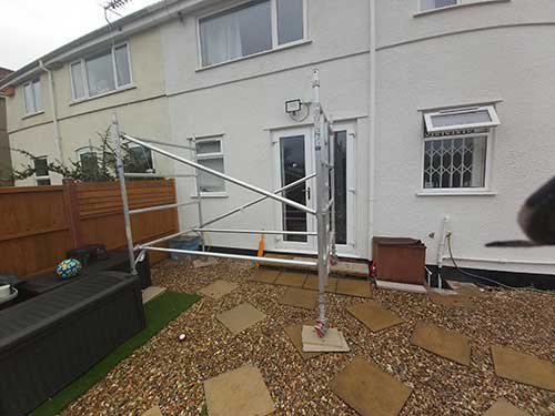 Erecting tower scaffold on a flat and level base
