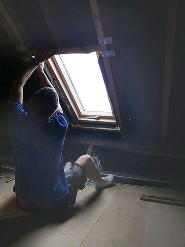 Insert Velux window in hole and position