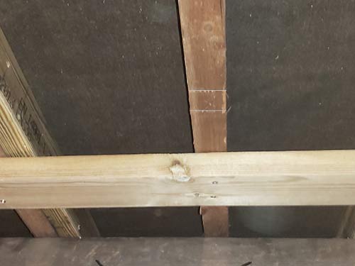 Mark timber thickness and cutting point across rafters top and bottom