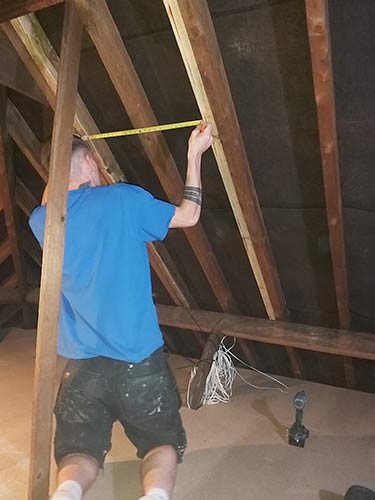Fix side bracing timbers to existing rafters