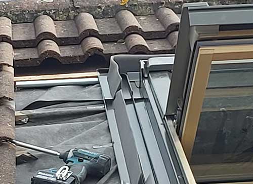 Top section of flashing fixed in place
