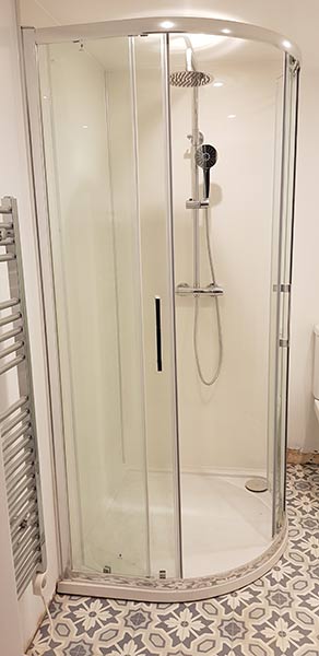 Quadrant shower enclosure installed in bathroom