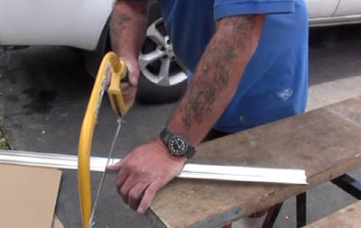 Cutting shower panel beads with a hacksaw