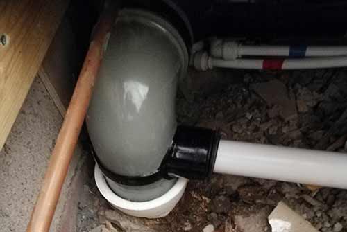 Strap on boss connected to soil pipe