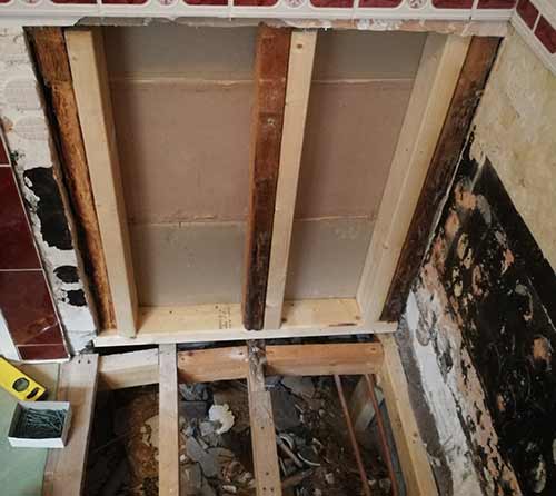 Damaged bathroom wall and floor timbers replaced