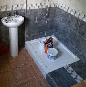 Raised shower tray