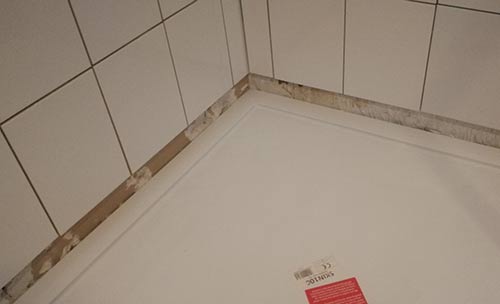 Repaired wall retiled with ceramic tiles