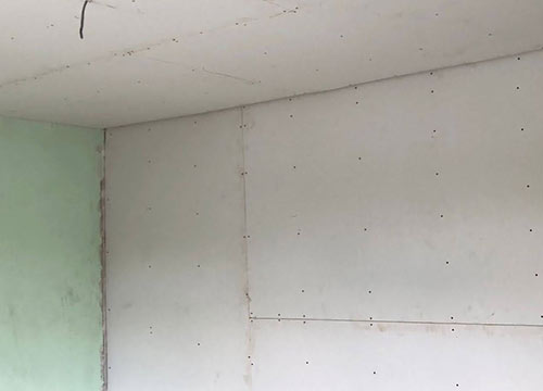 Plasterboard stud wall ready for plastering