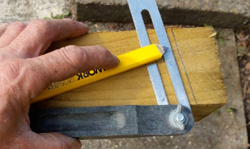 Marking a fence post with a sliding bevel
