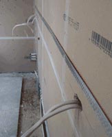 Electrical wires in plasterboard wall