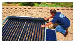 Solar thermal panels being installed on roof