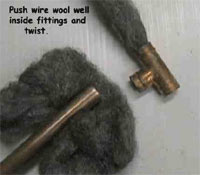 Cleaning copper pipes with wire wool