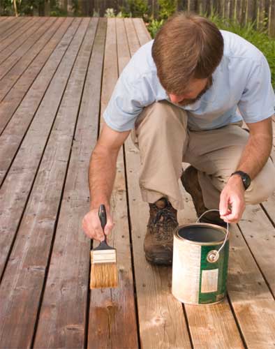 Applying decking stain with a brush