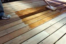 Applying decking stain with pad