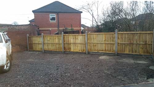 Installing concrete fence posts and gravel boards