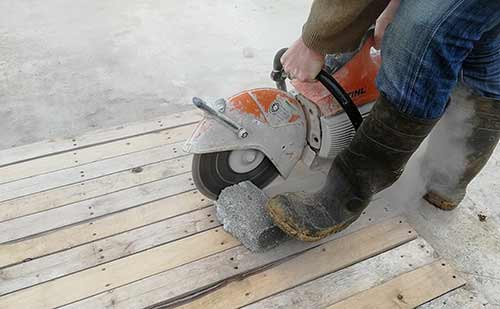 Cutting through concrete block in stages