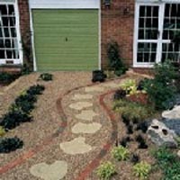 Driveway completed using light scalpings and patio slabs