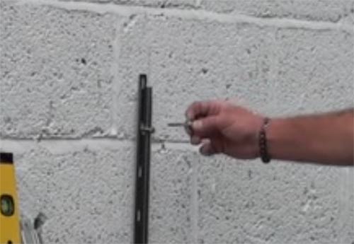 Drill out holes and insert wall plugs