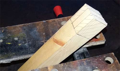Timber gripped in Workmate for cutting