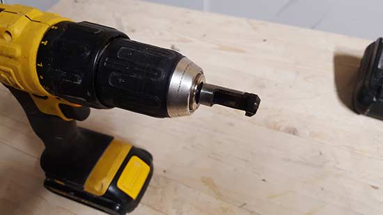 Plug cutter inserted into drill