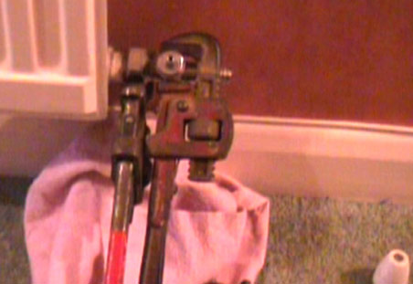 Undoing radiator valves to remove radiator