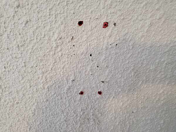 Holes drilled and wall plugs inserted