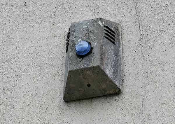 Old dummy alarm box on the side of a property