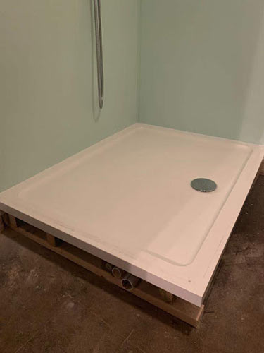 Raised shower tray