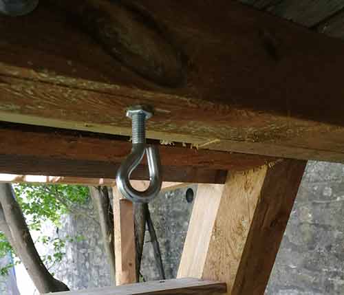 Eye bolt fixed to underside of playhouse