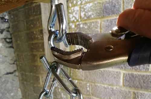 Closing up s-hooks using mole grips