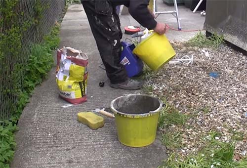 Pouring Tyrolean solution into Tyrolean gun