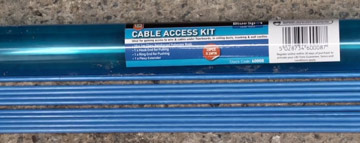Pulling cables through walls with a cable access kit
