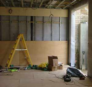 Boarding over membrane fixed to wall