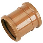 Coupling for joining plastic drain pipes together