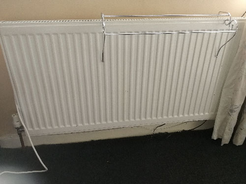Radiator that needs to be raised up before laying floating floor
