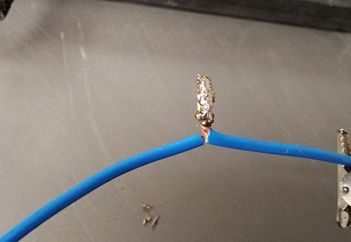 Solder wire melted on to wires bonding them together