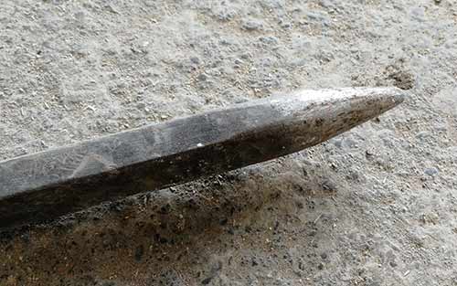 Pointed end of wrecking bar