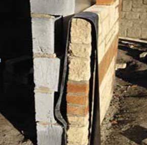 Vertical DPC damp membrane inserted between two walls