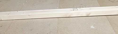 Warped timber on flat surface
